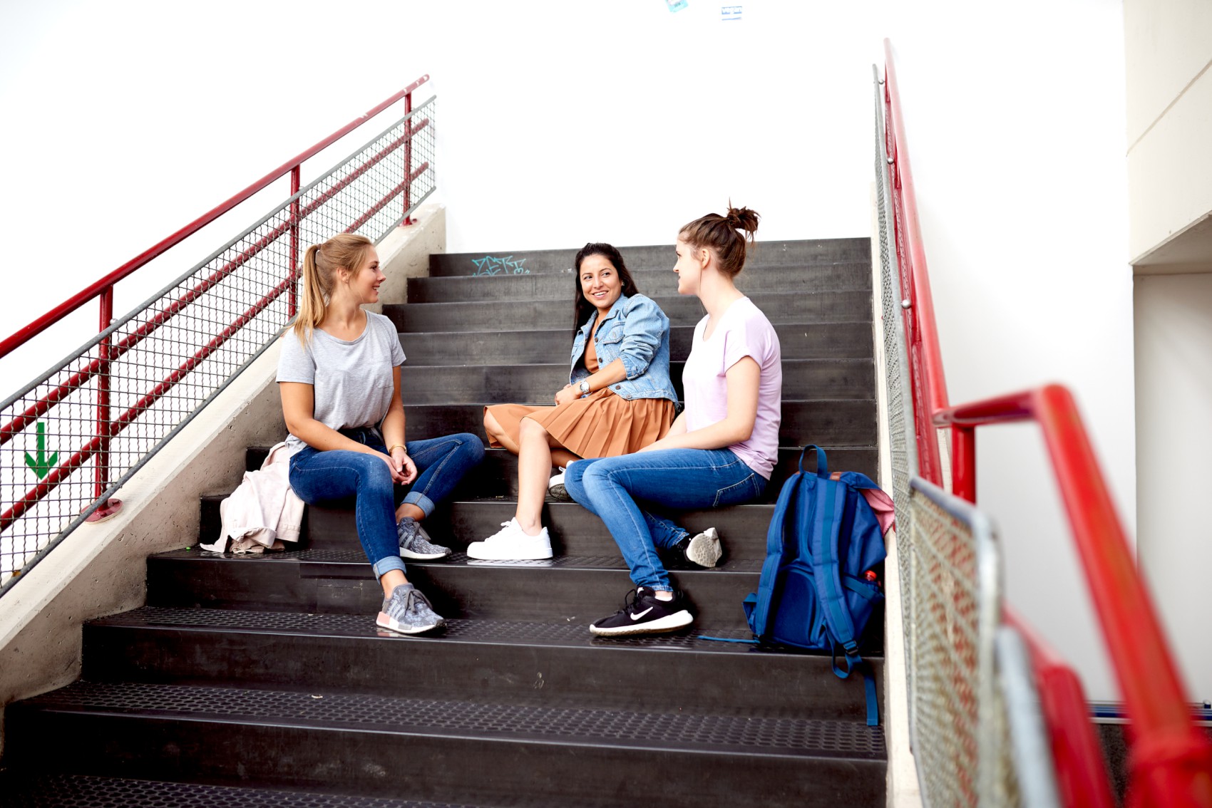 students sitting on stairs